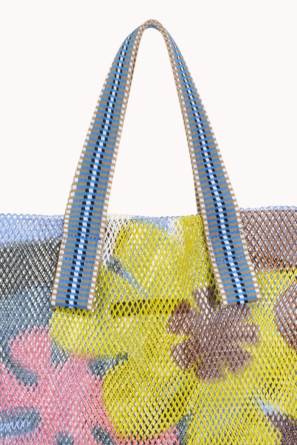 Handle detail on small mesh tote in blue with multi colored flowers.-24508064235713