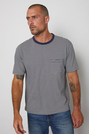 Eli striped crew neck tee with front patch pocket and  navy contrast rib band around neckline.