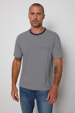 Eli striped crew neck tee with front patch pocket and  navy contrast rib band around neckline.