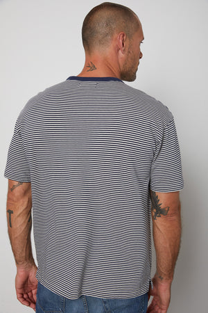 Eli striped crew neck tee with front patch pocket and  navy contrast rib band around neckline back