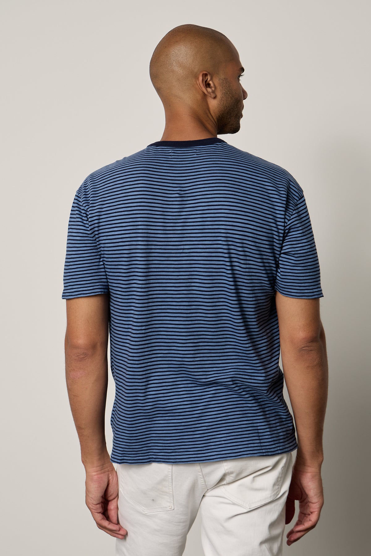 Jeremy Crew Neck Tee with medium and dark blue stripes, front pocket, paired with white denim back-26249324036289