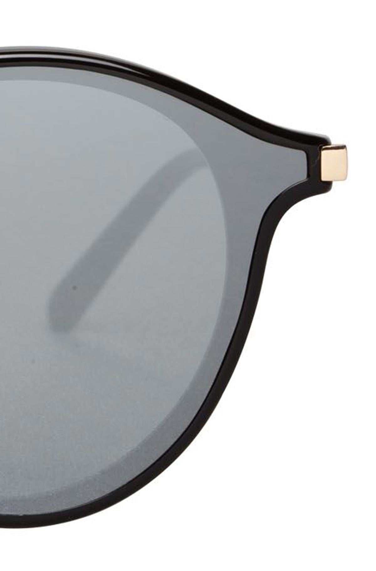   A pair of black SUMMIT sunglasses by Bonnie Clyde with gold frames. 