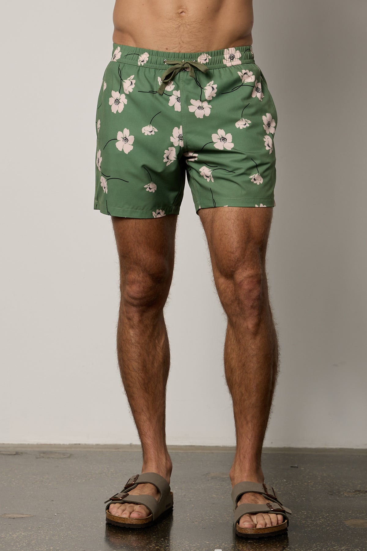   Ricardo Swim Short in print with green background and bold white floral front 