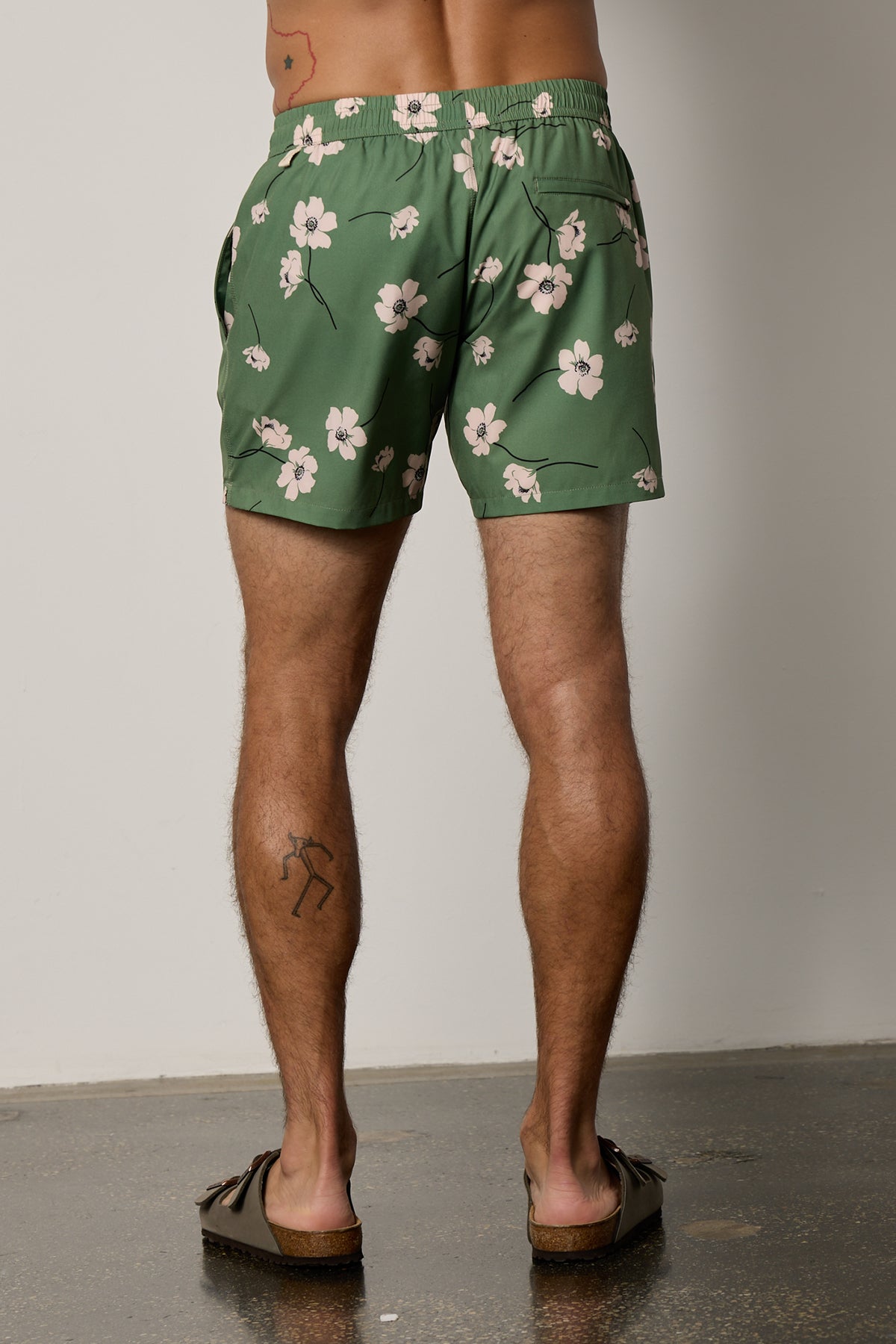   Ricardo Swim Short in print with green background and bold white floral back 