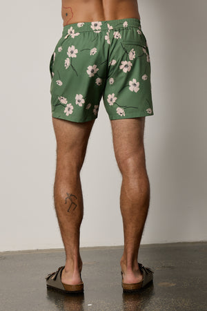 Ricardo Swim Short in print with green background and bold white floral back