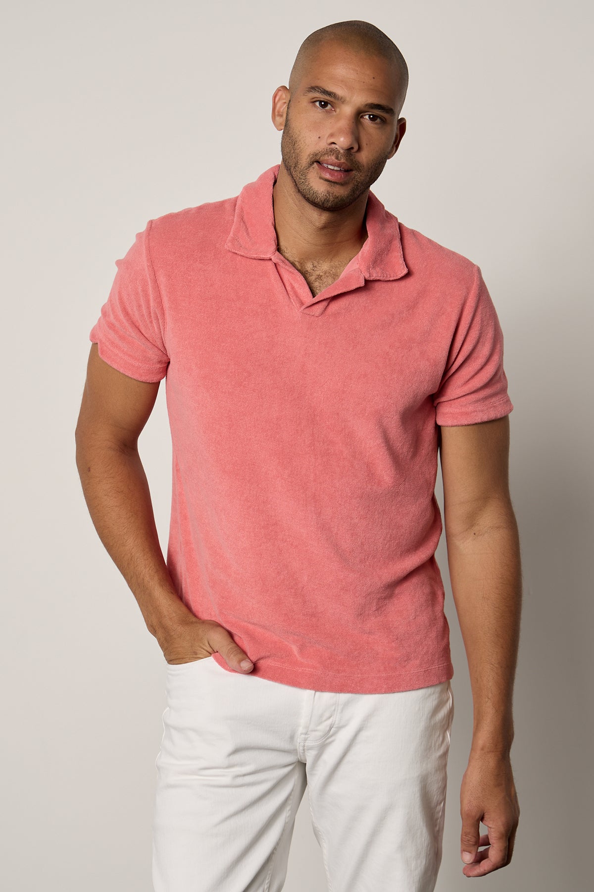 a man wearing a Velvet by Graham & Spencer BORIS TERRY POLO shirt and white pants.-26266324631745