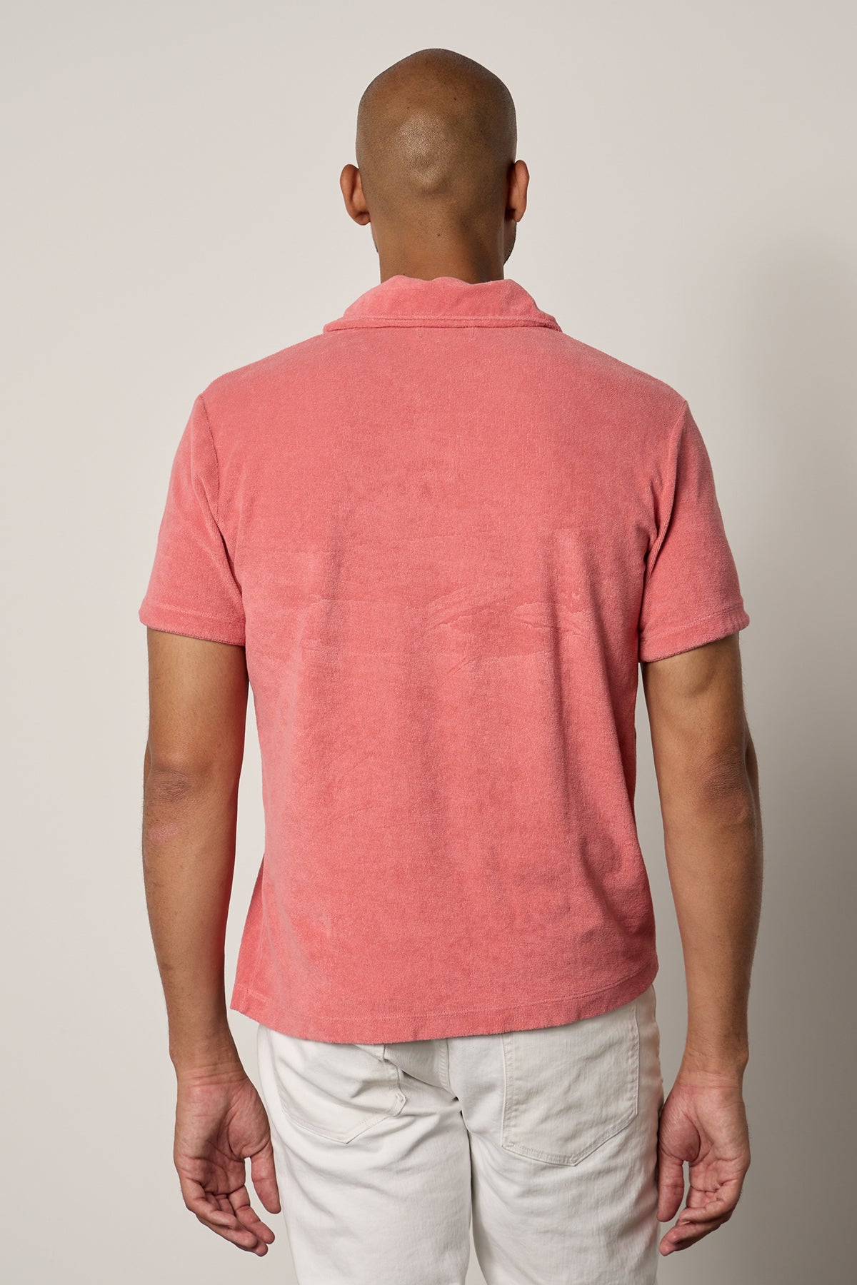 The back view of a man wearing a Velvet by Graham & Spencer BORIS TERRY POLO shirt.-26266324697281