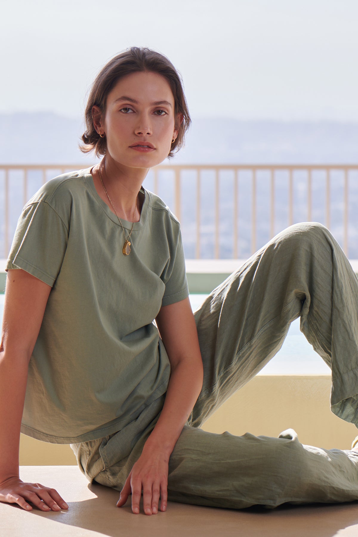 a woman sitting on the edge of a pool wearing Velvet by Jenny Graham's PICO PANT and a t-shirt-26293126398145