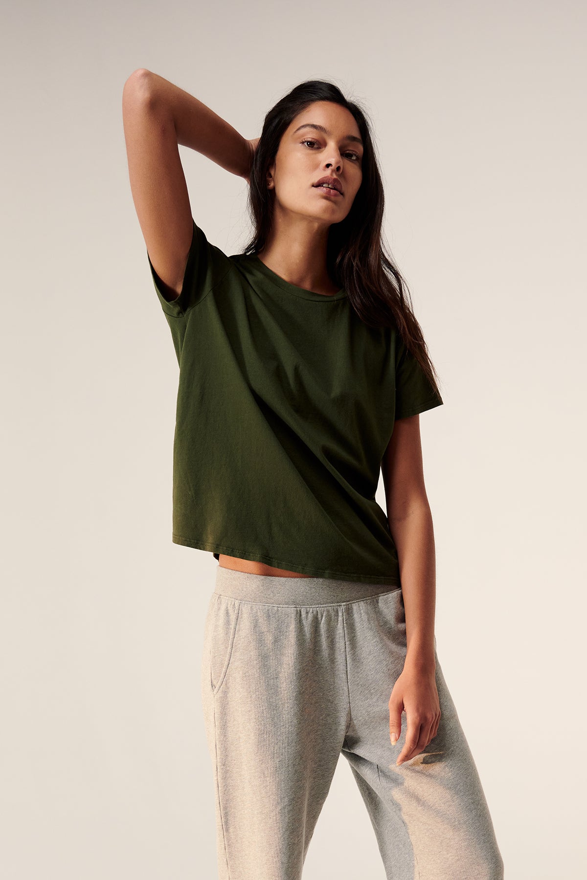 a woman wearing a Velvet by Jenny Graham Topanga Tee and grey sweatpants.-25156605280449