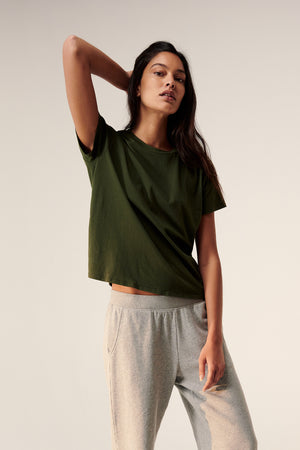 a woman wearing a Velvet by Jenny Graham Topanga Tee and grey sweatpants.