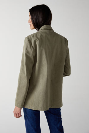 the back view of a woman wearing the Velvet by Jenny Graham ECHO BLAZER jacket.