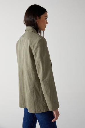the back view of a woman wearing an ECHO BLAZER jacket by Velvet by Jenny Graham.
