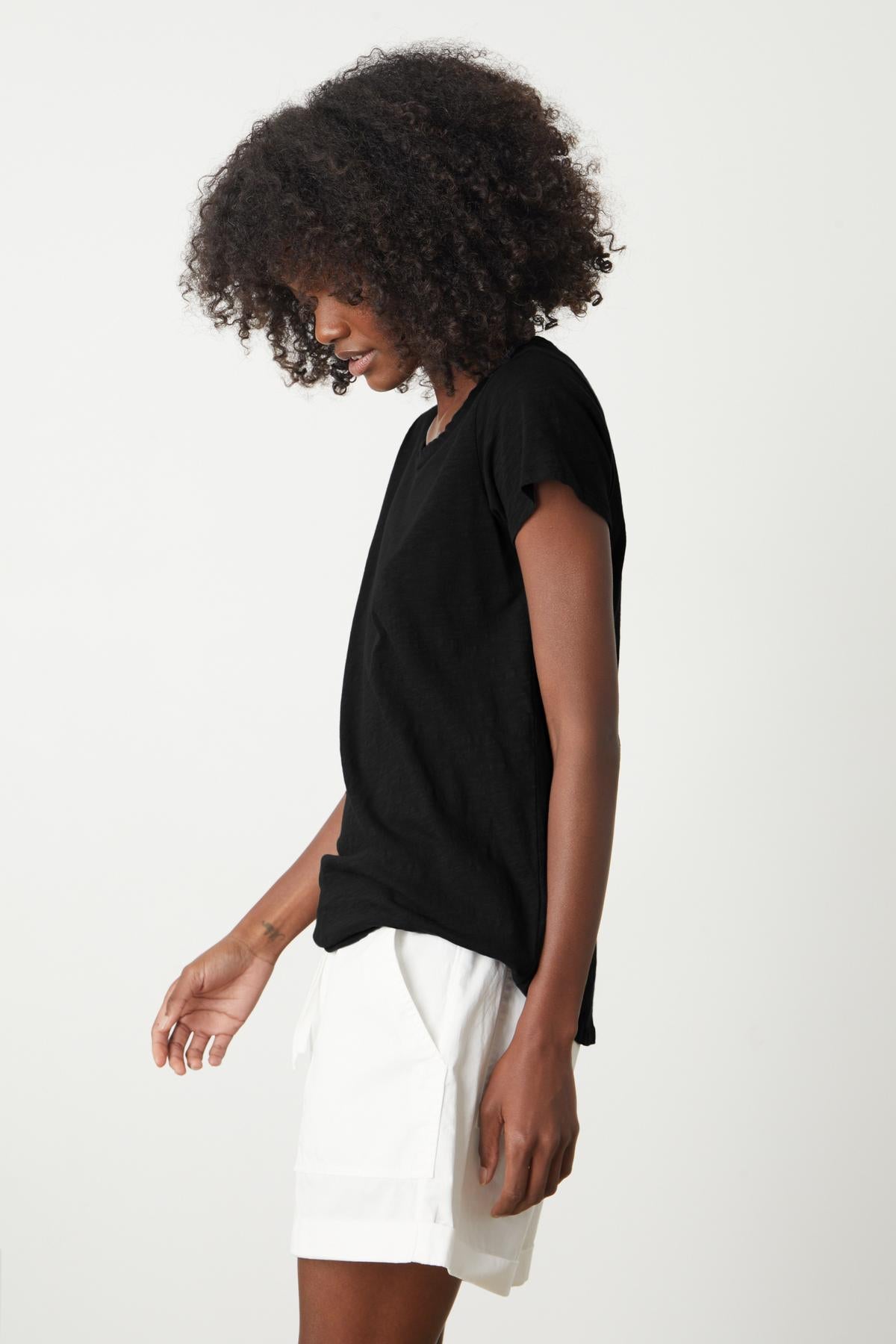 a woman wearing a Velvet by Graham & Spencer TILLY ORIGINAL SLUB CREW NECK TEE and white shorts.-26235782070465