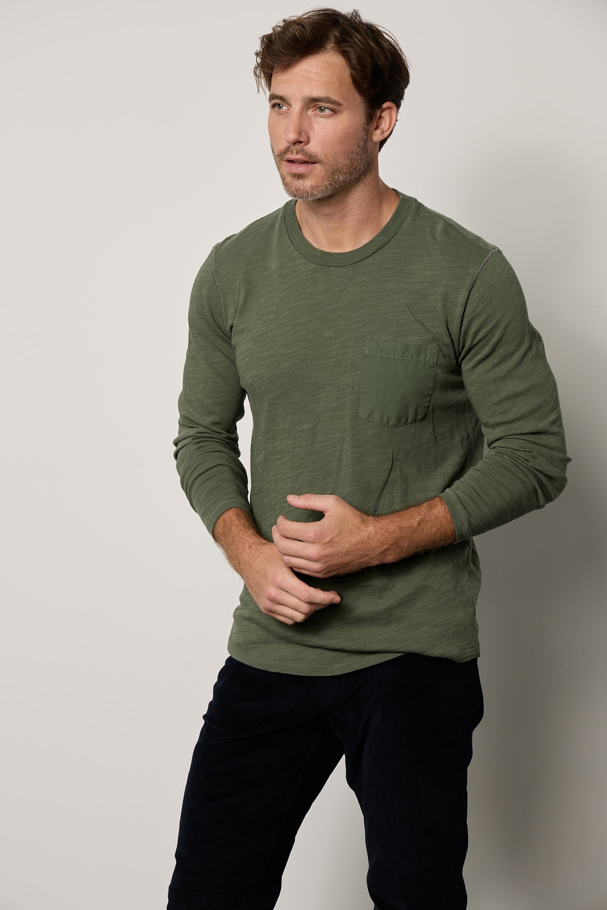 Victor Crew Neck Long Sleeve tee in palm green with black denim front-25854956044481