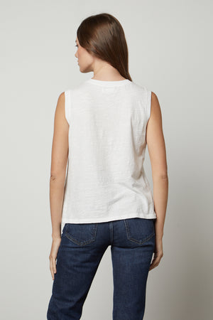The back view of a woman wearing Velvet by Graham & Spencer's ELLEN VINTAGE SLUB TANK TOP and jeans.