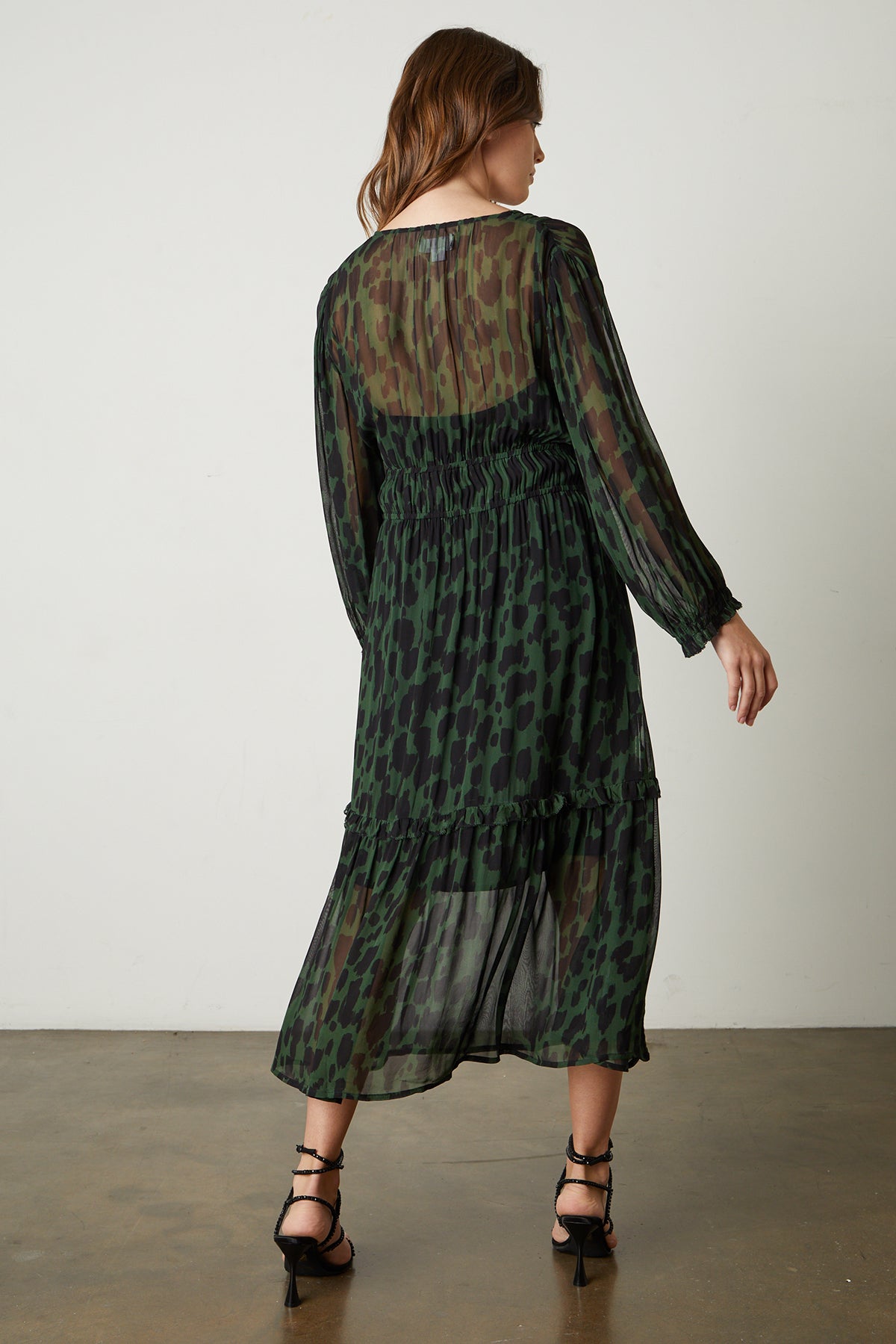   Kendra Printed Maxi Dress in green and black airbrush print with black sandals full length back 