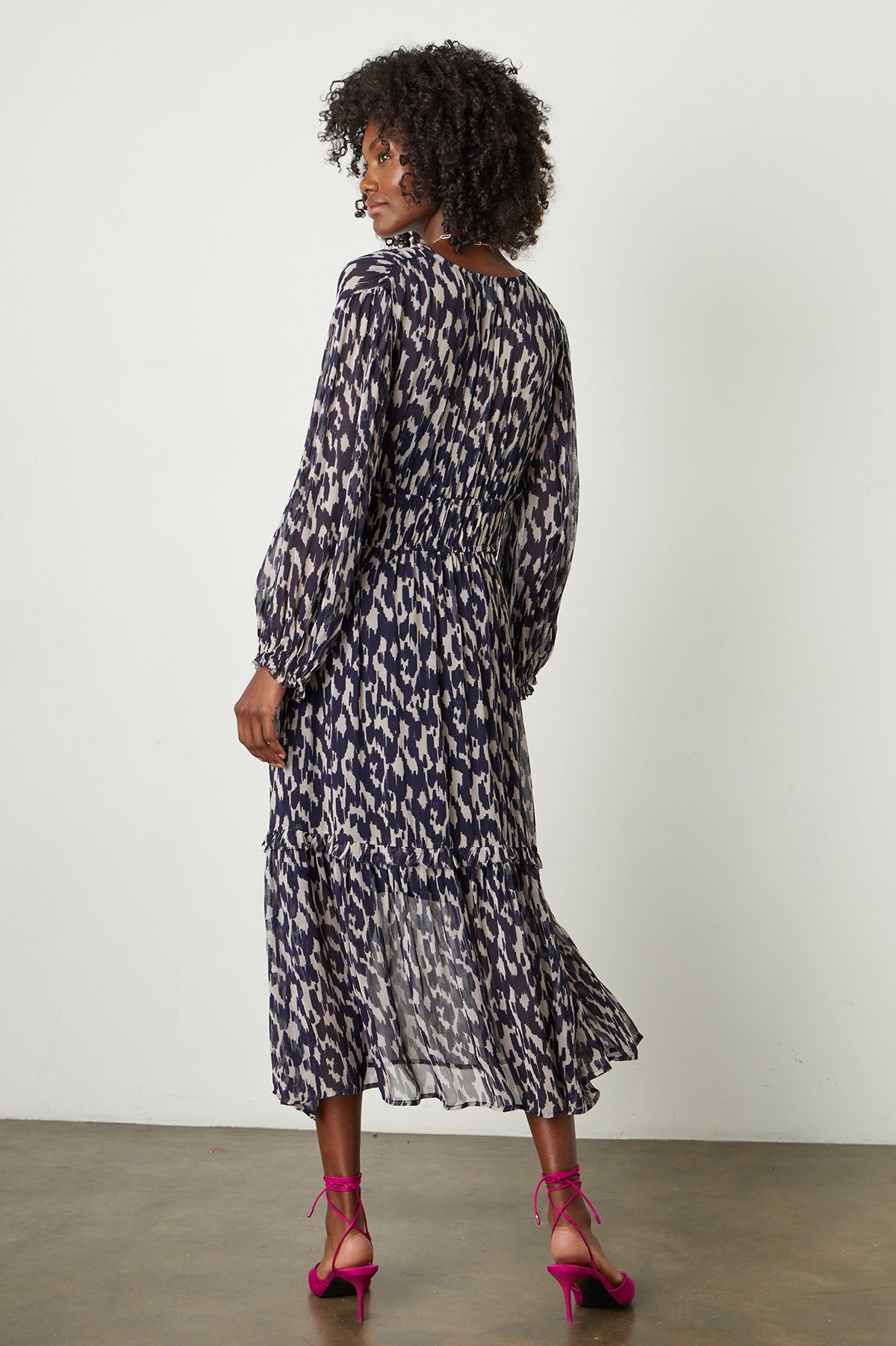   Kendra Printed Maxi Dress in calico print with hot pink heels full length back 