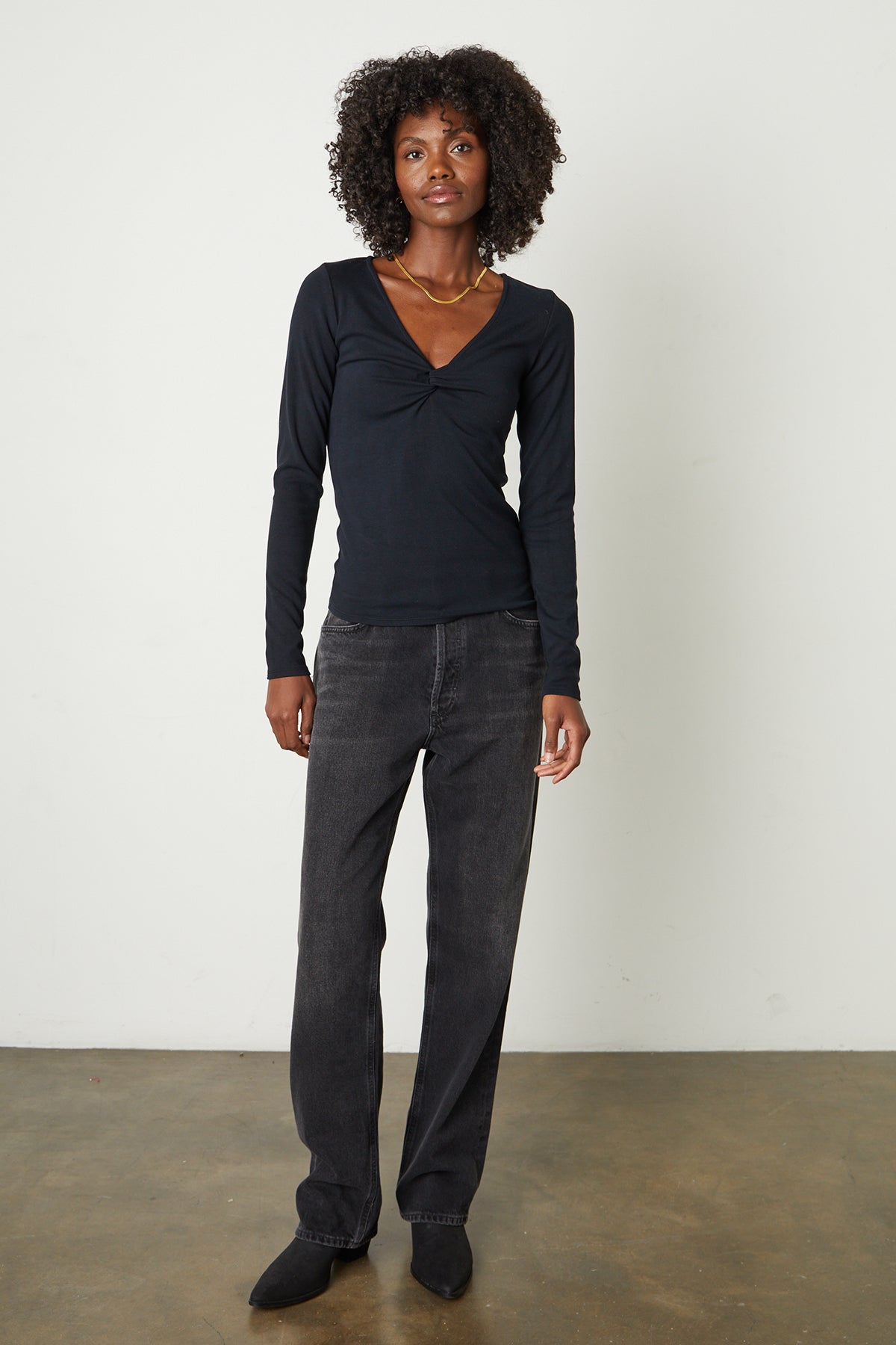   Brandi Viscose Rib V-Neck Top in jet black with black denim, boots, and gold necklace, full length front 