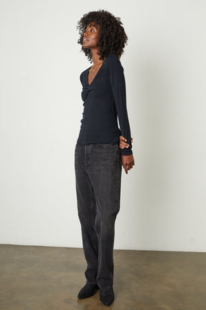 Brandi Viscose Rib V-Neck Top in jet black with black denim, boots, and gold necklace, full length side & front