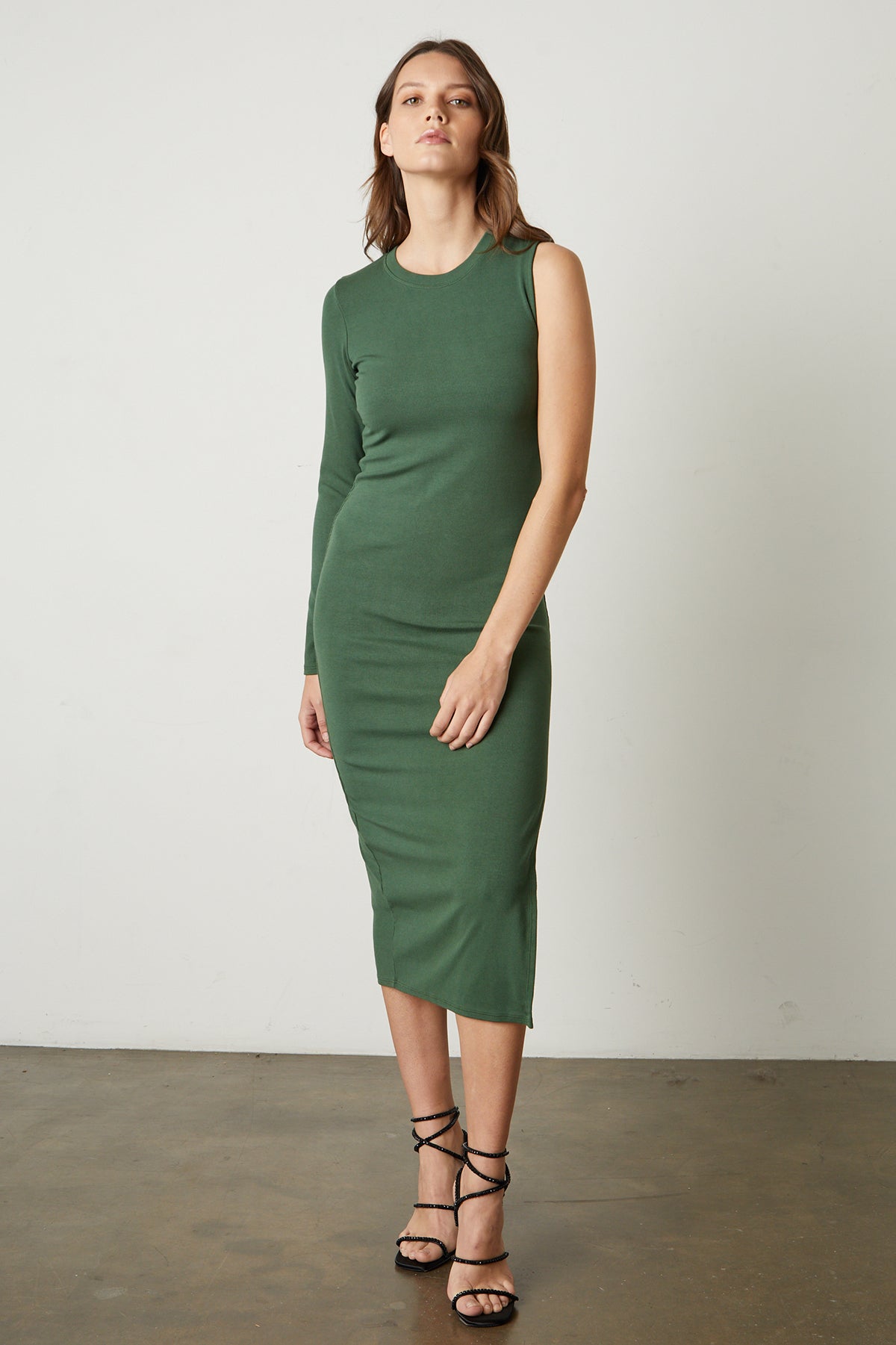   Trina Asymmetrical Midi Dress in willow green full length front with black sandal heels 
