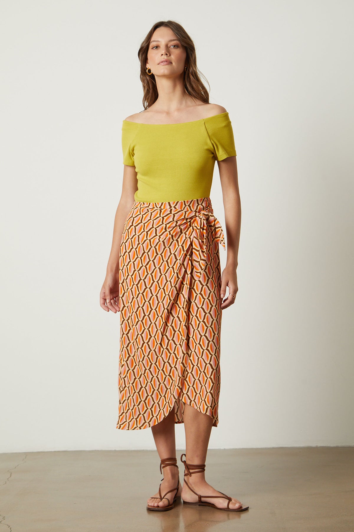 Alisha skirt in orange geometric pattern with Eloise body suit in sundance yellow with sandals full length front-26078932009153