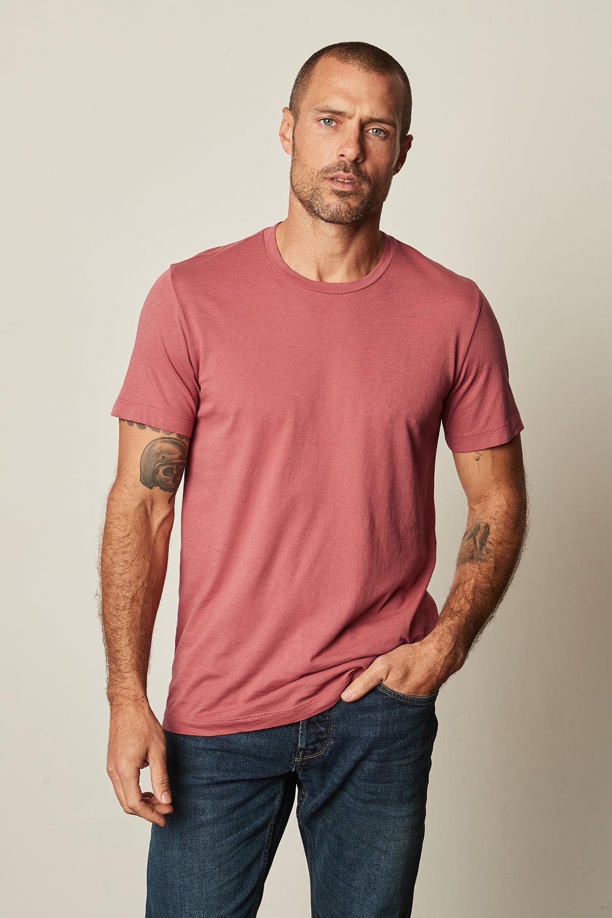 A man wearing a Velvet by Graham & Spencer HOWARD WHISPER CLASSIC CREW NECK TEE and jeans.-25793661403329