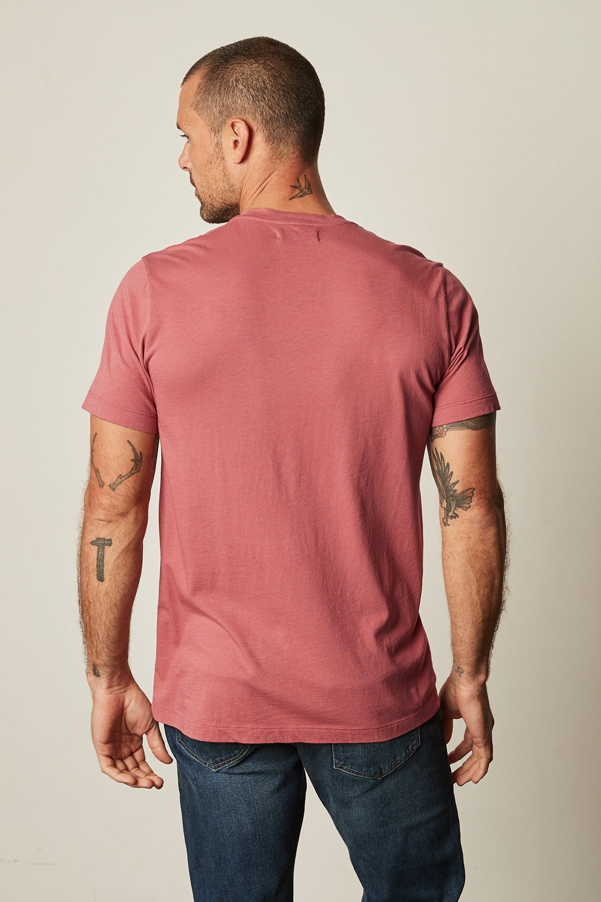 The best-selling vintage-feel softness of the HOWARD WHISPER CLASSIC CREW NECK TEE by Velvet by Graham & Spencer is shown in the back view of a man.-25793661468865