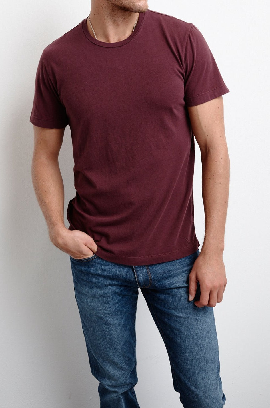   A man wearing the Velvet by Graham & Spencer HOWARD WHISPER CLASSIC CREW NECK TEE and jeans. 