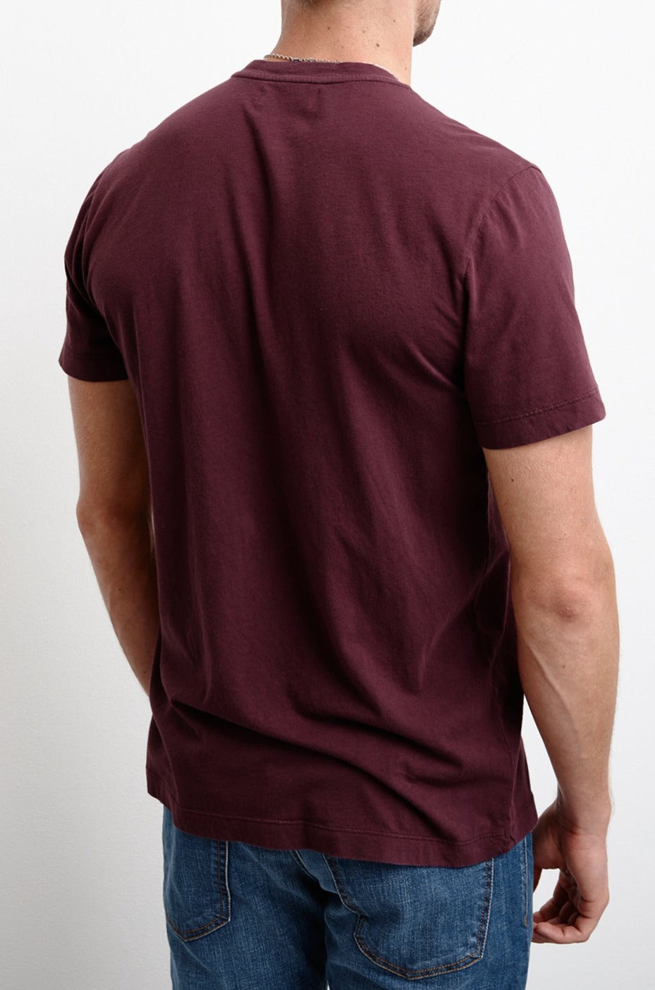   The back view of a man wearing a Velvet by Graham & Spencer HOWARD WHISPER CLASSIC CREW NECK TEE in maroon. 