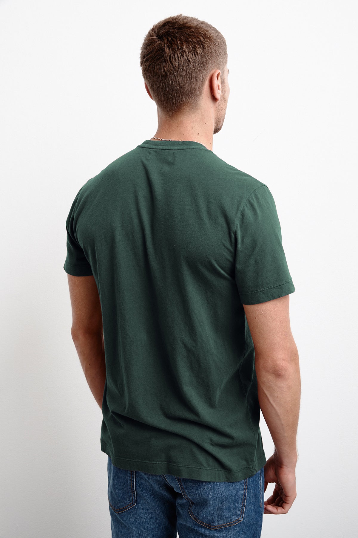 The back view of a man wearing a green Velvet by Graham & Spencer Howard Whisper Classic Crew Neck Tee.-1012412416081