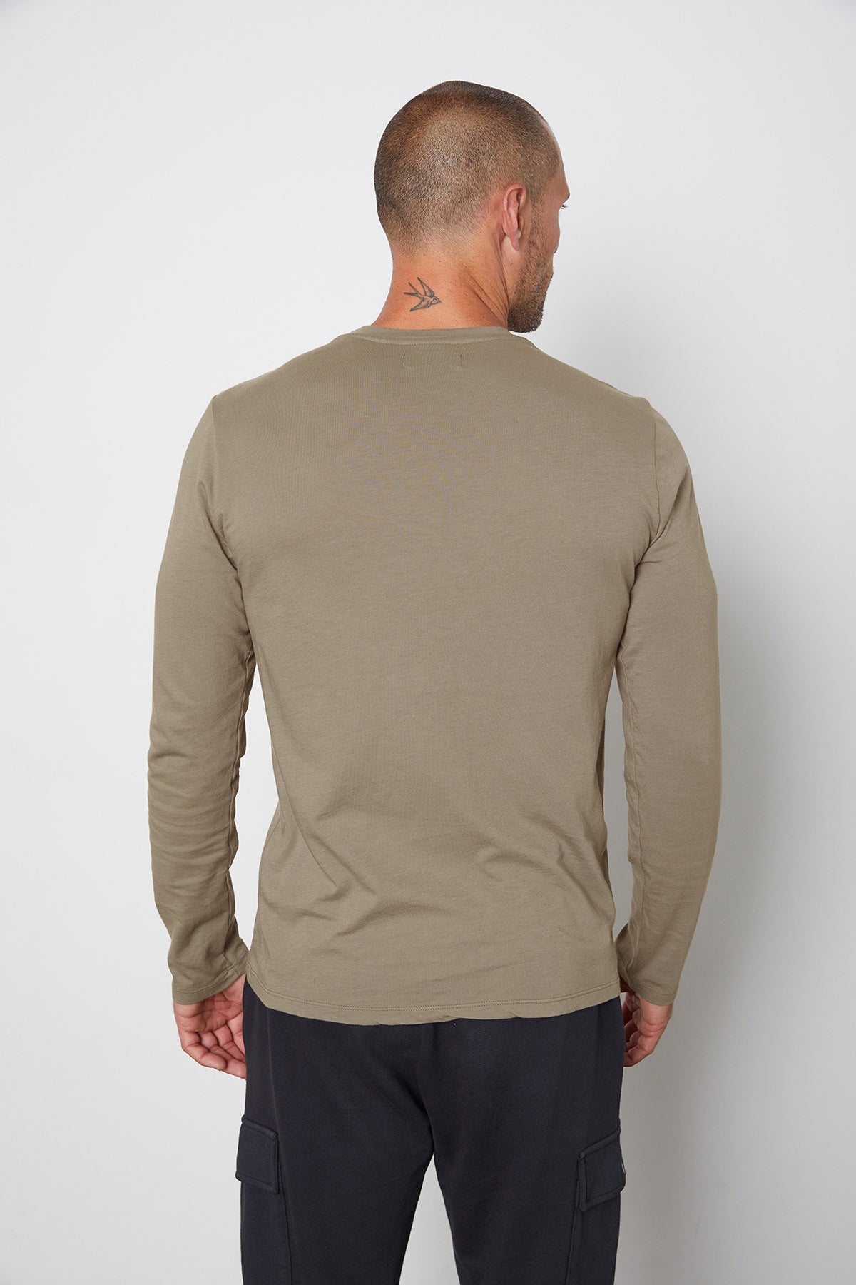 The back view of a man wearing a Velvet by Graham & Spencer SKEETER WHISPER CLASSIC CREW NECK TEE.-25794008875201
