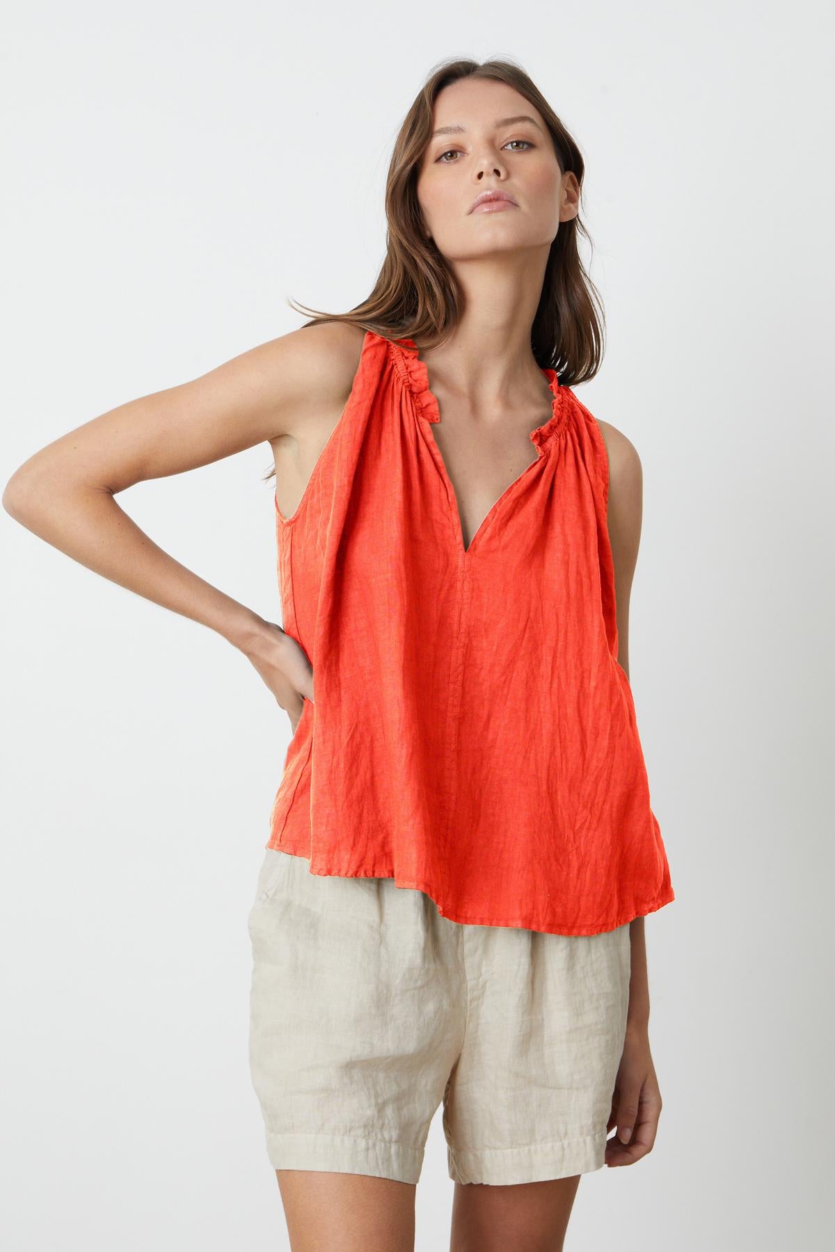   Zoey Tank Top in crimson linen with Tammy shorts model standing with hand on hip facing front 