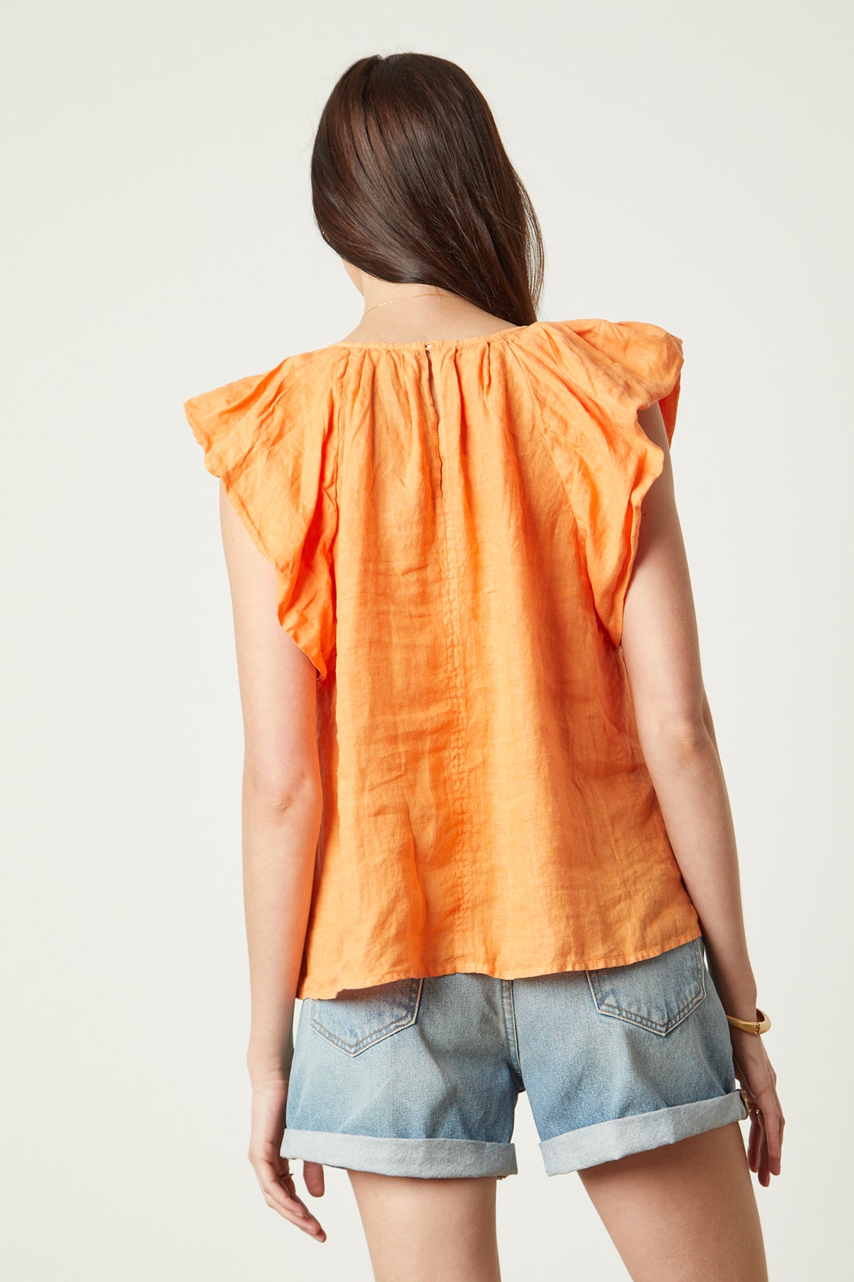 Ava Linen V-Neck Top in orange heat color with blue denim shorts back-26078935646401
