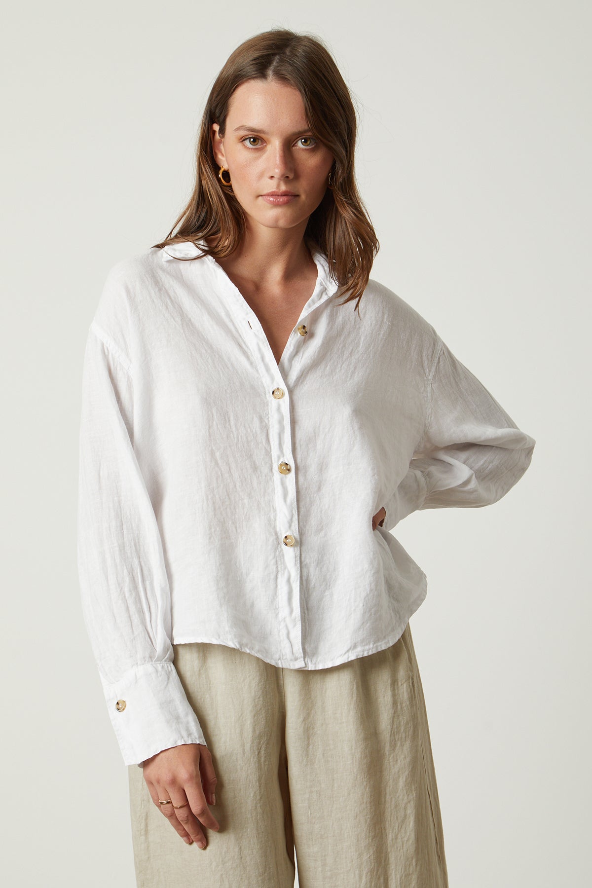   Eden button up shirt in white with Lola pant in cobble front woman hand on hip 