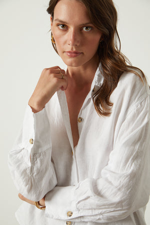 Eden button up shirt in white close up front woman hand on collar