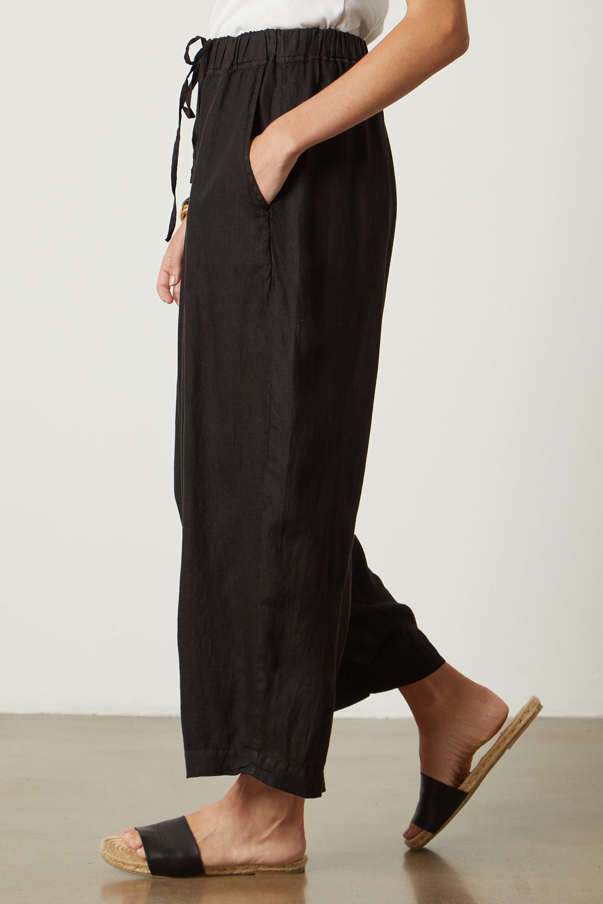 Hannah Linen Pant in black side with model hand in pocket-26142779670721