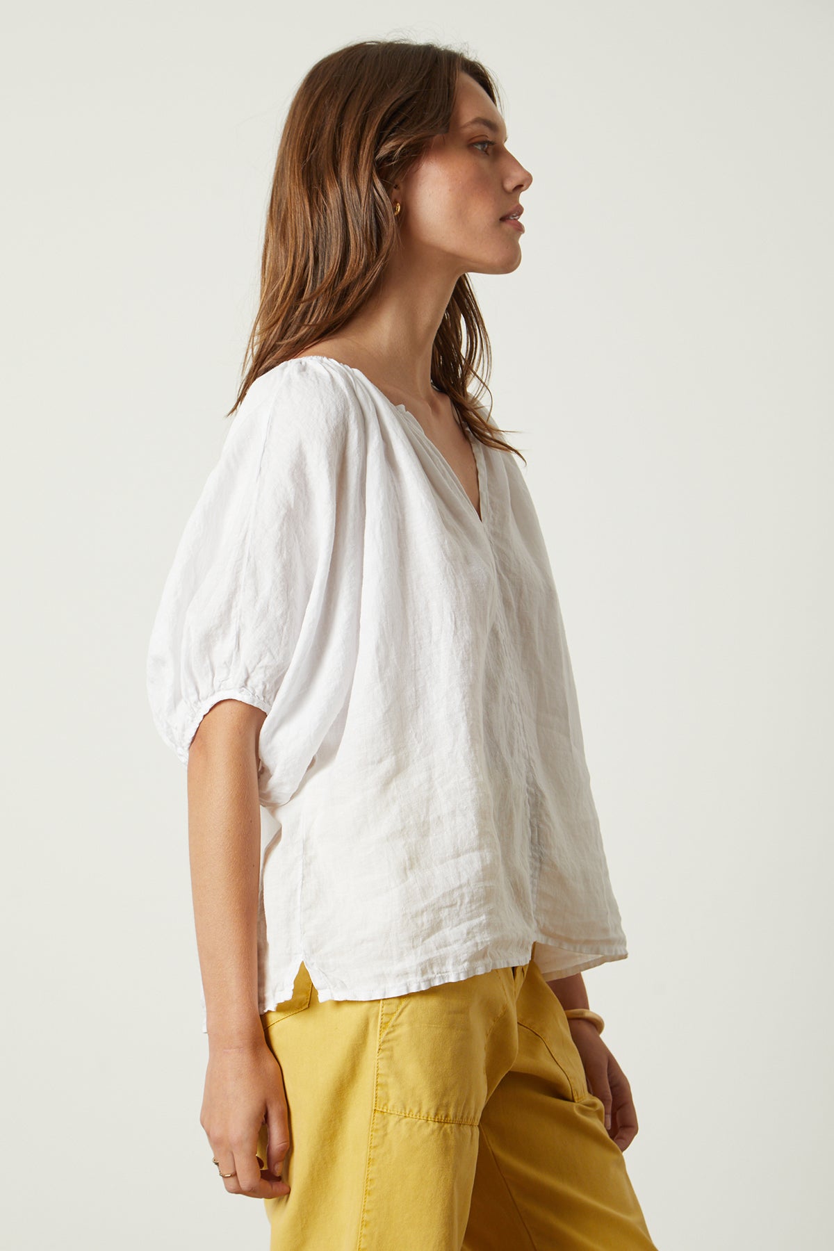 The model is wearing a Velvet by Graham & Spencer JANINE LINEN TOP.-26142774821057