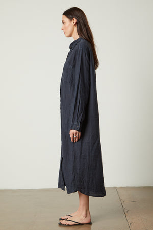 The model is wearing a JORA LINEN BUTTON-UP DRESS dress by Velvet by Graham & Spencer.