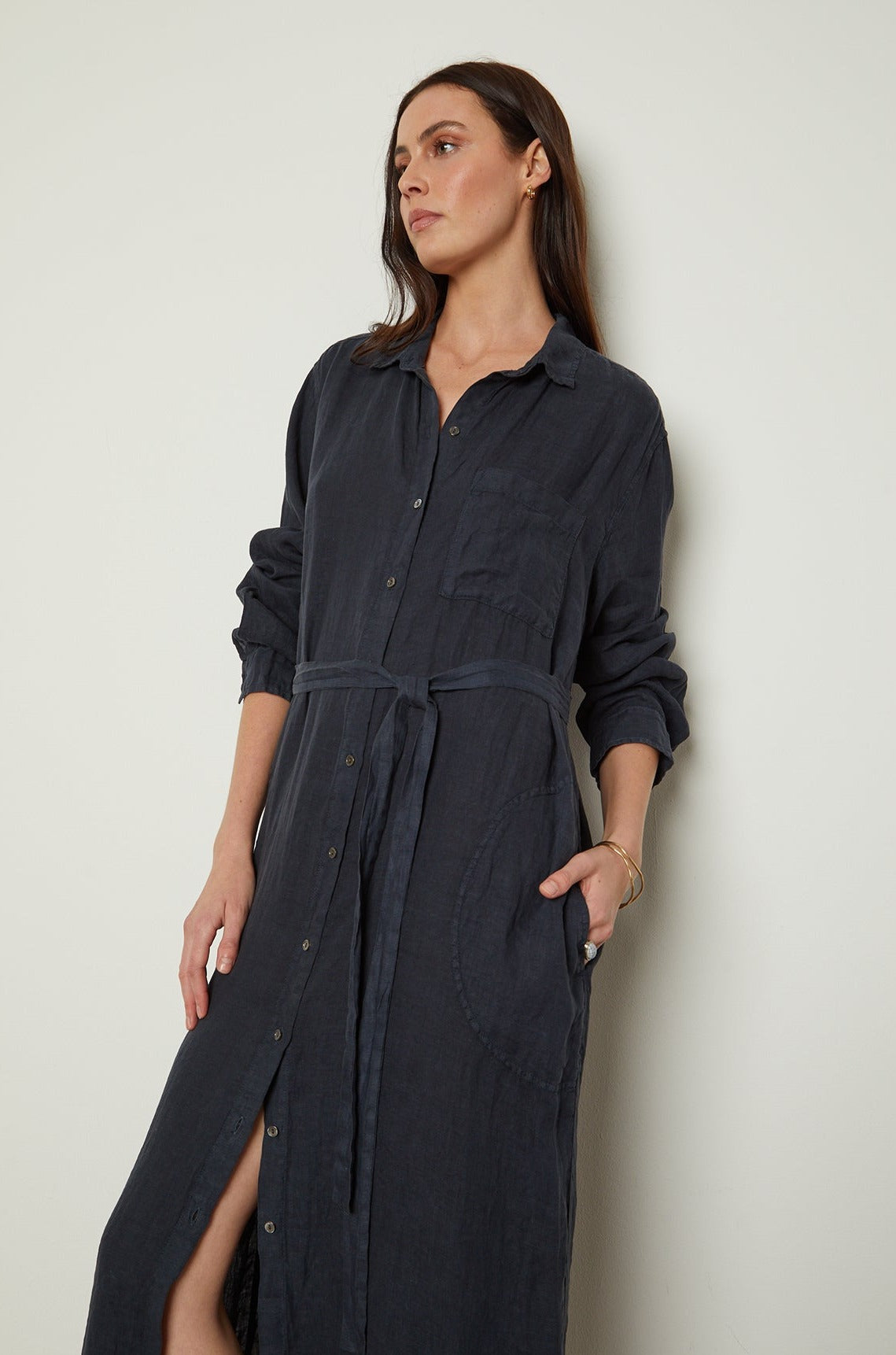 The model is wearing a JORA LINEN BUTTON-UP DRESS by Velvet by Graham & Spencer.-26143085592769