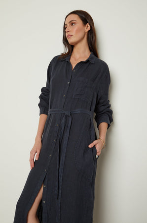 The model is wearing a JORA LINEN BUTTON-UP DRESS by Velvet by Graham & Spencer.