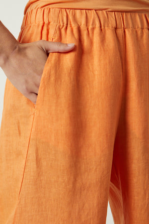Lola pant in orange heat linen front and pocket detail