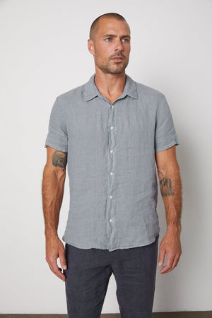 The MACKIE LINEN BUTTON-UP SHIRT in grey is a must-have addition to your summer wardrobe.