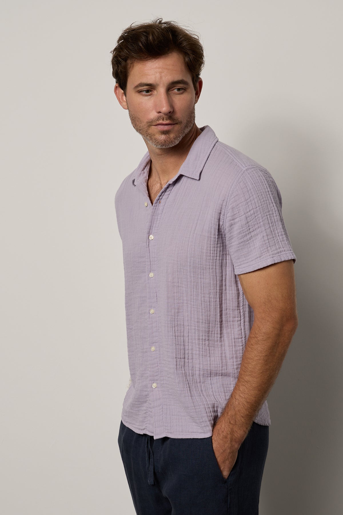   Christian Shirt in lilac with Vann pants in navy side & front model with hand in pants pocket 