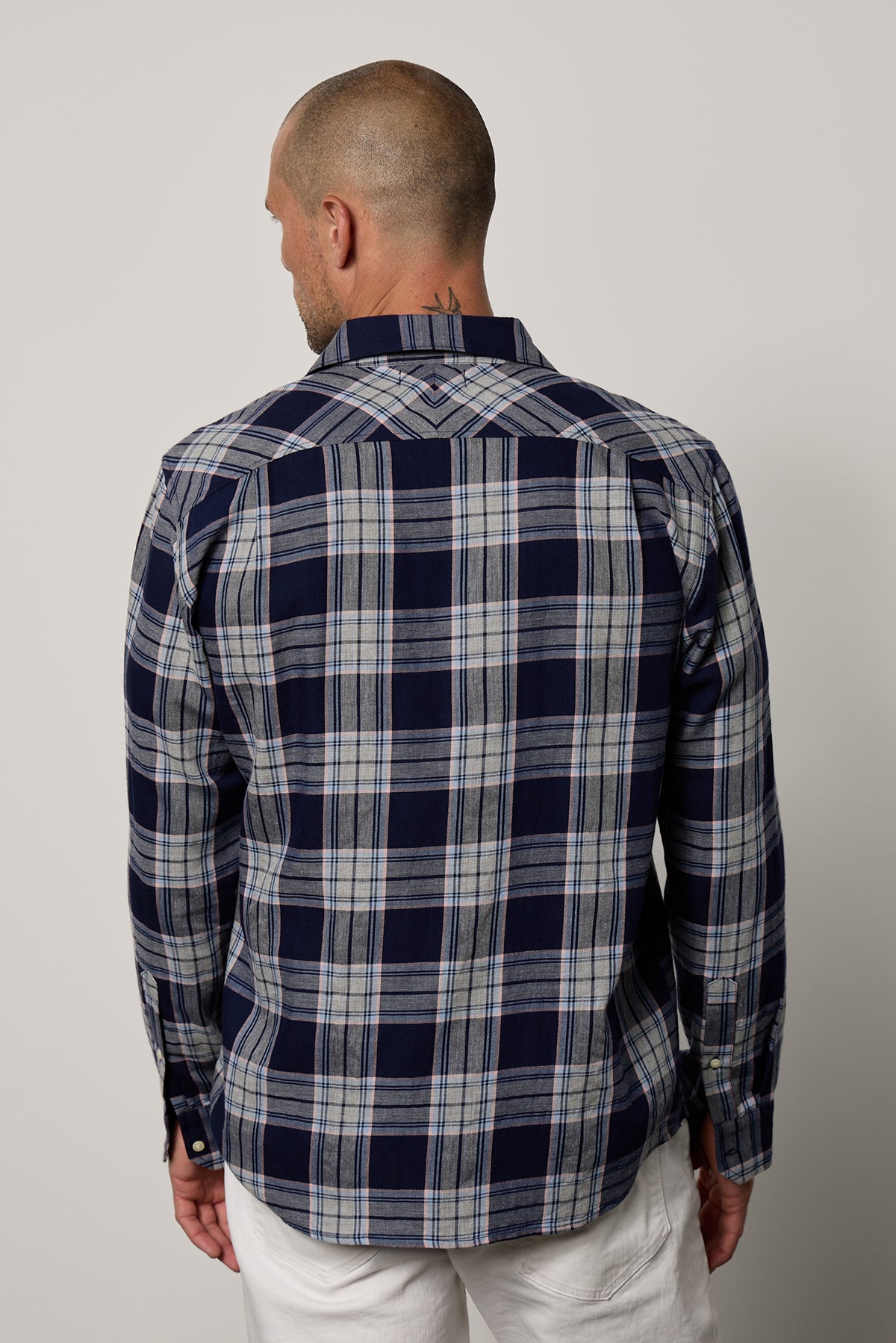 the back view of a man wearing a Velvet by Graham & Spencer LEONARD PLAID BUTTON-UP SHIRT.-26079100469441