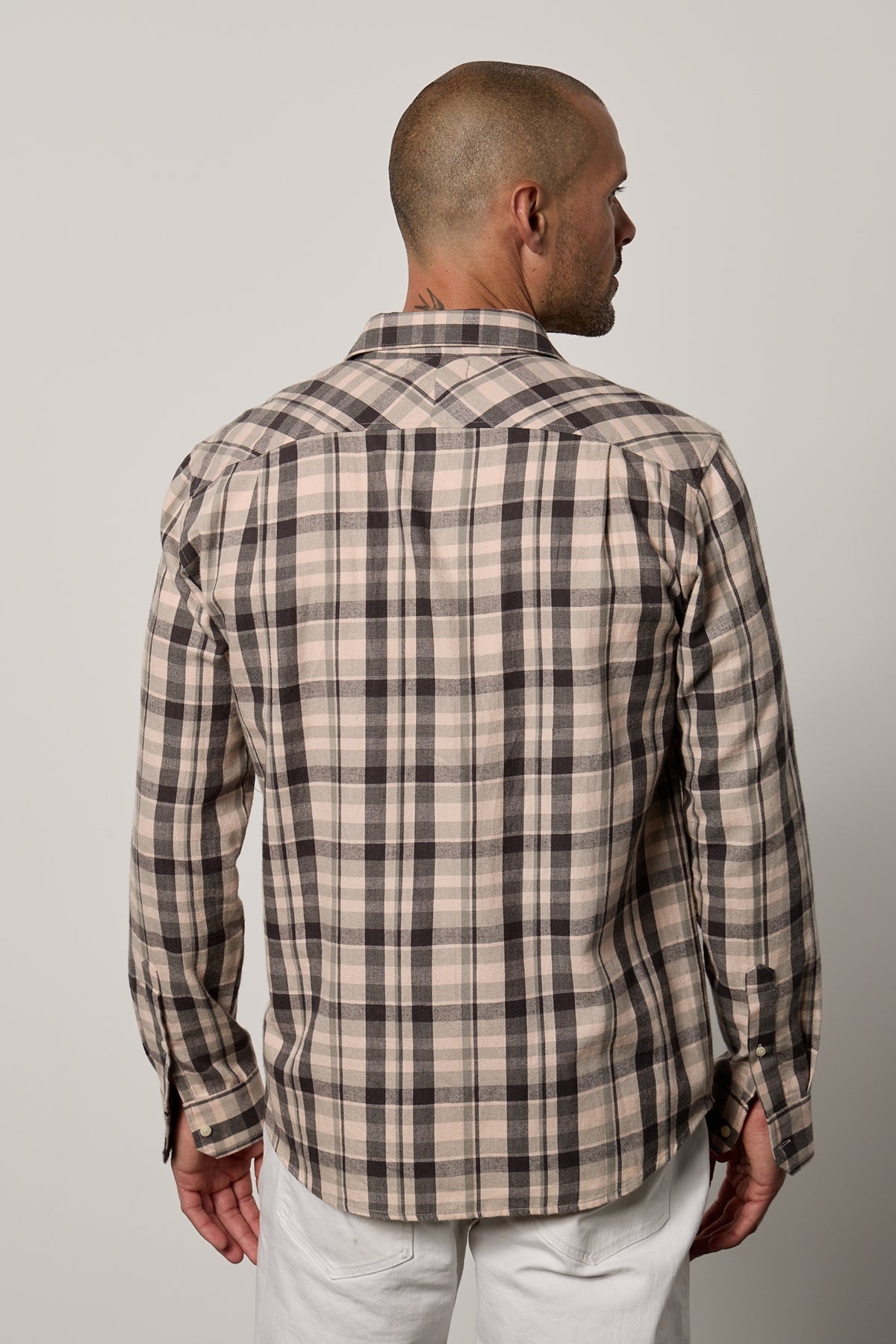 the back view of a man wearing a Velvet by Graham & Spencer Leonard Plaid Button-Up Shirt.-26079099748545