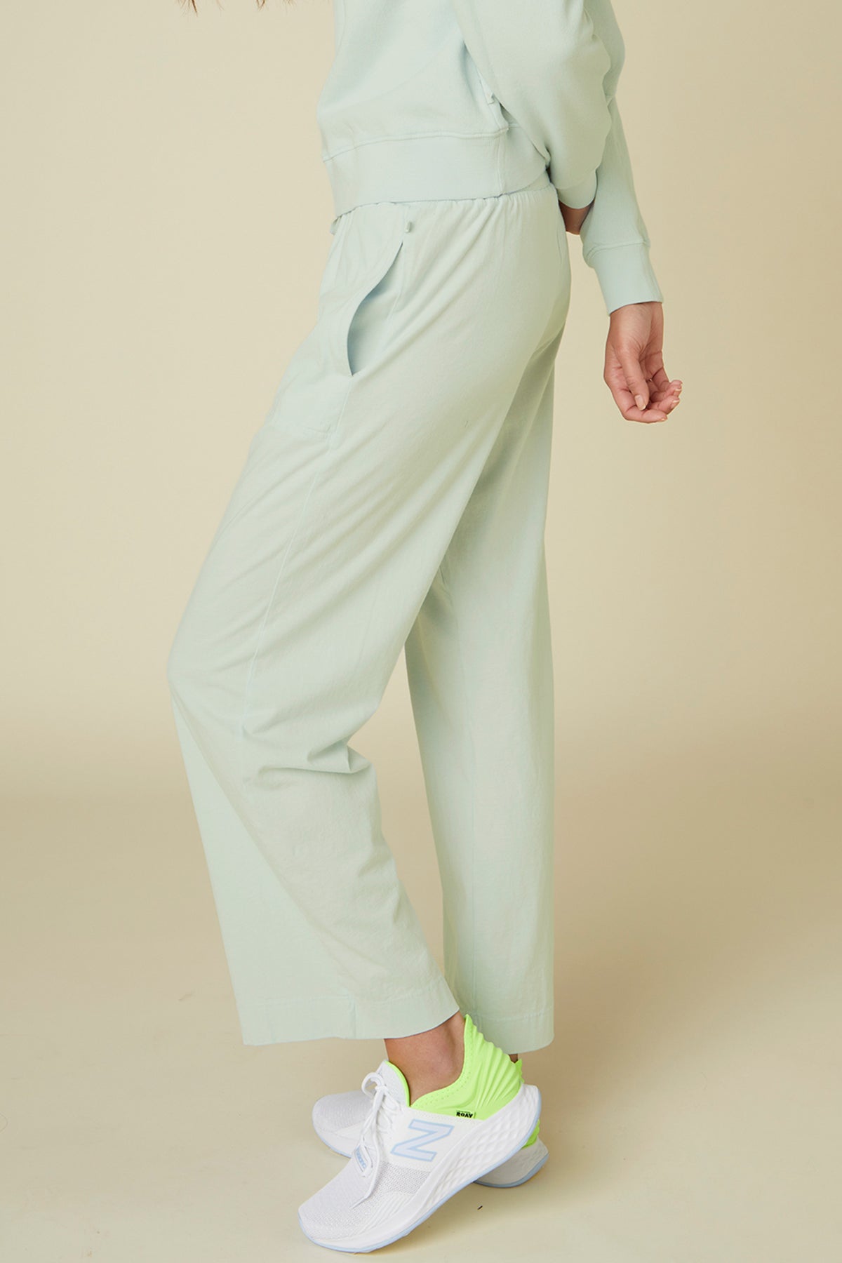   Pismo pant in pale mint green showing side and pocket. 